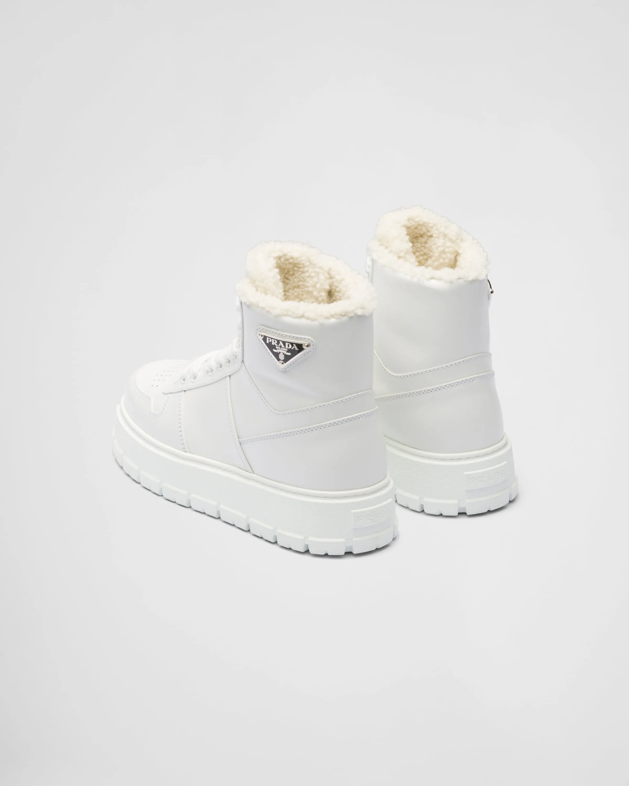 Leather and shearling high-top sneakers