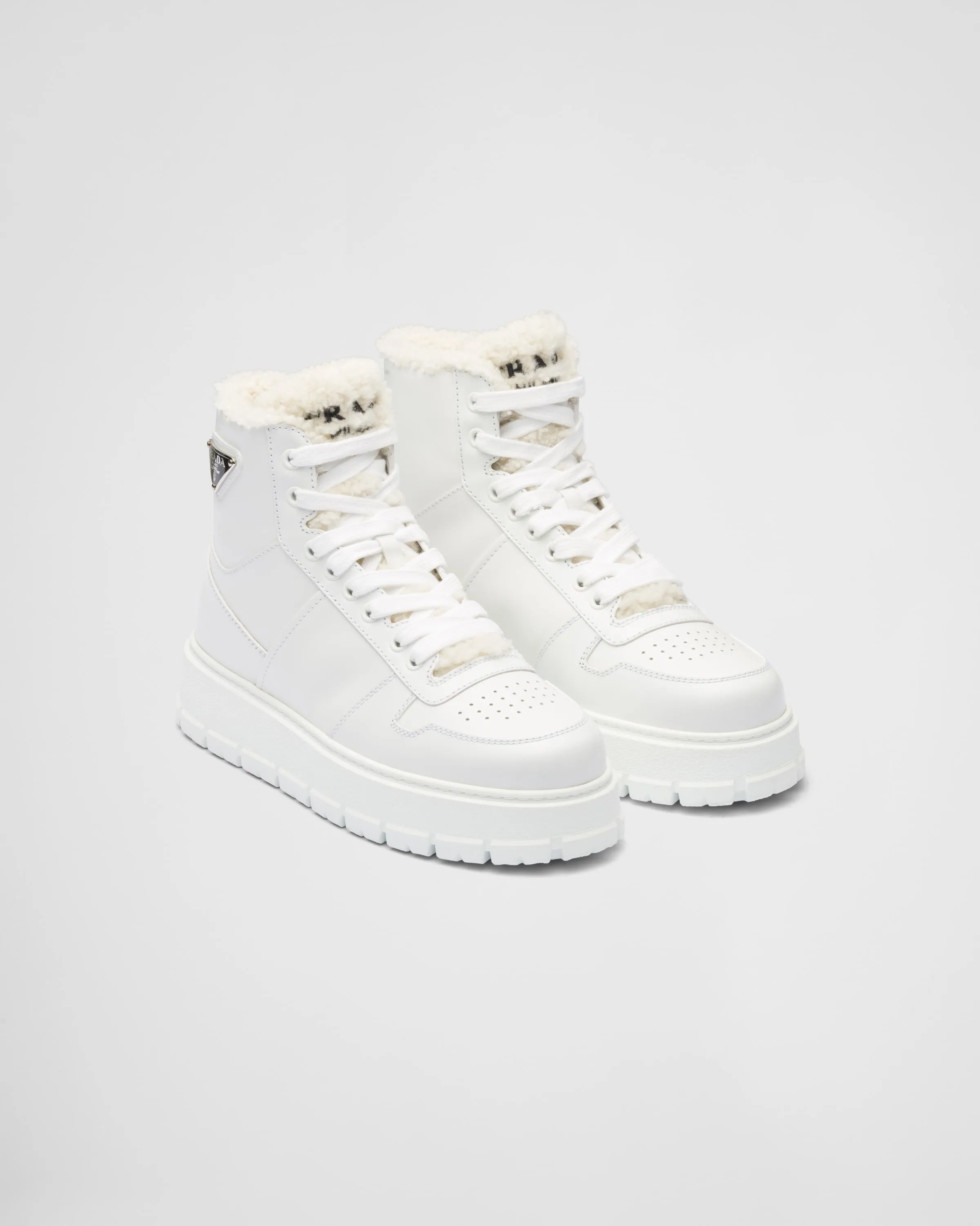 Leather and shearling high-top sneakers